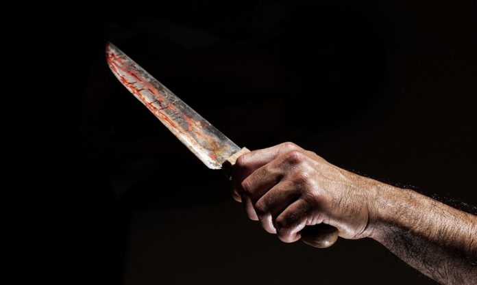 תמונת אילוסטרציה של סכין מגואלת בדם